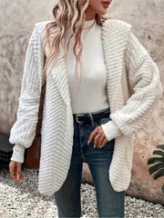 Textured ivory hooded cocoon coat with chevron pattern, open front, and cozy fleece material.