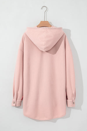 Blush pink waffle knit shacket with plaid trim and hood.