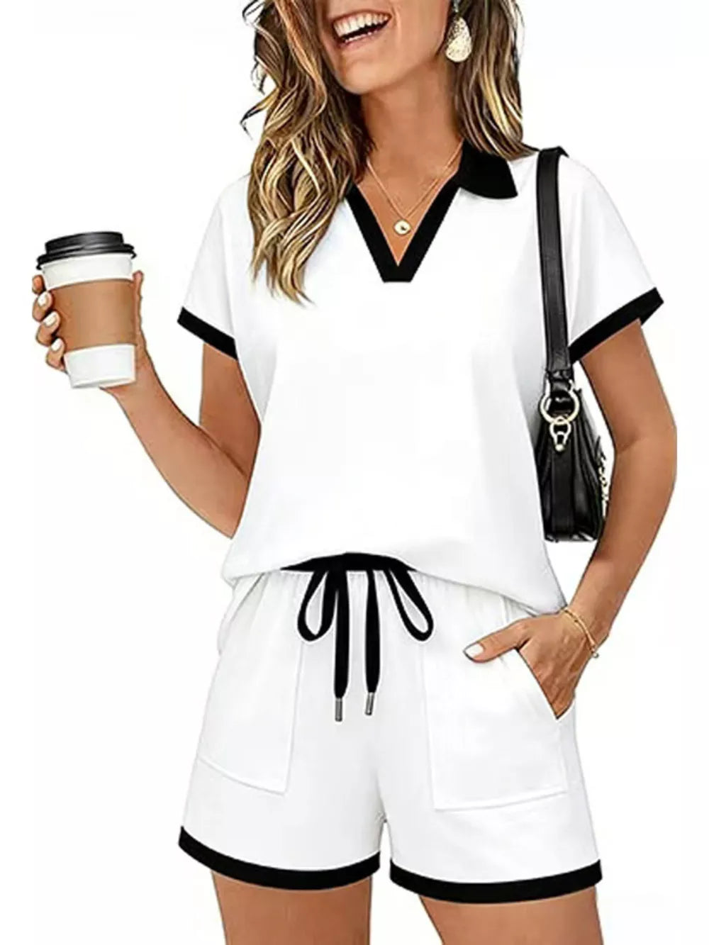 White polo collar two-piece set with black trim and drawstring shorts.