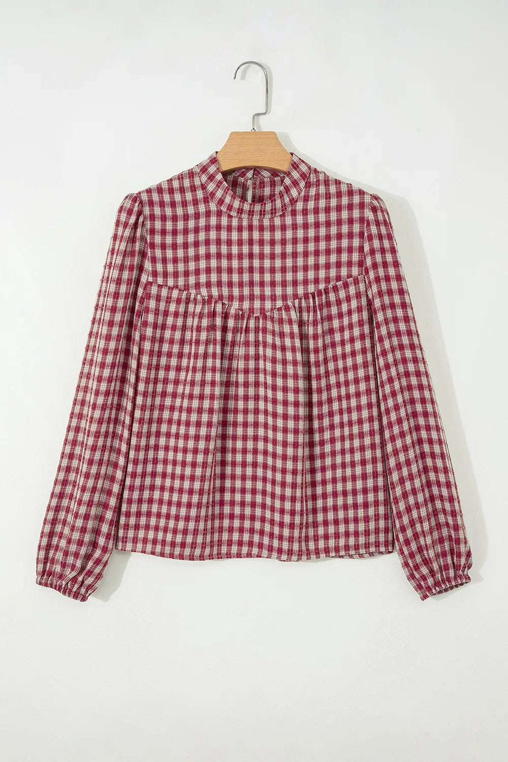 Country plaid long sleeve blouse with mock neck and keyhole detail.