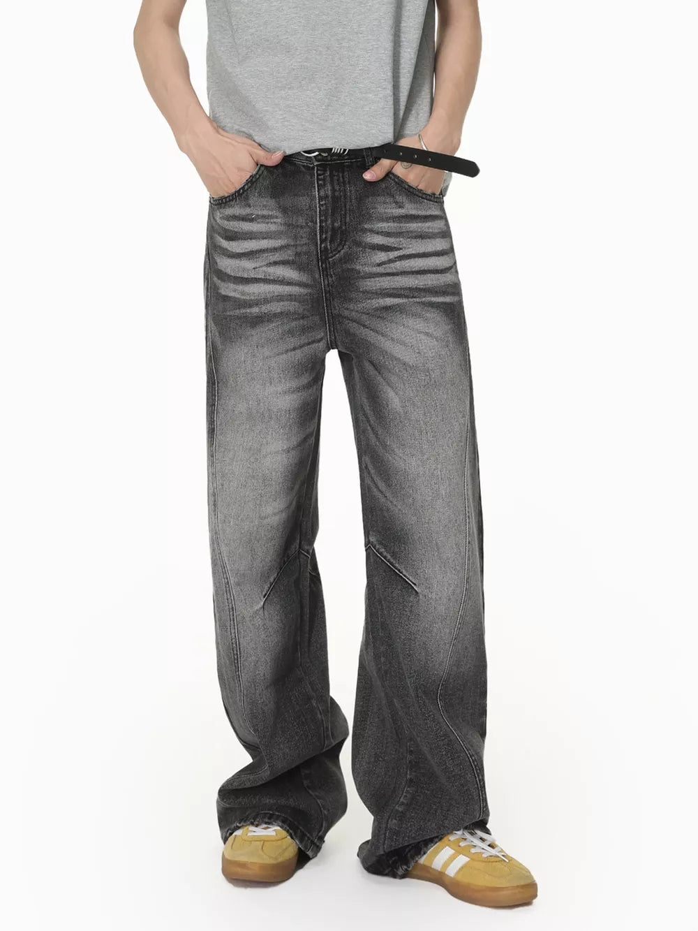 Men's dark wash wide leg jeans with faded detailing and a relaxed fit.