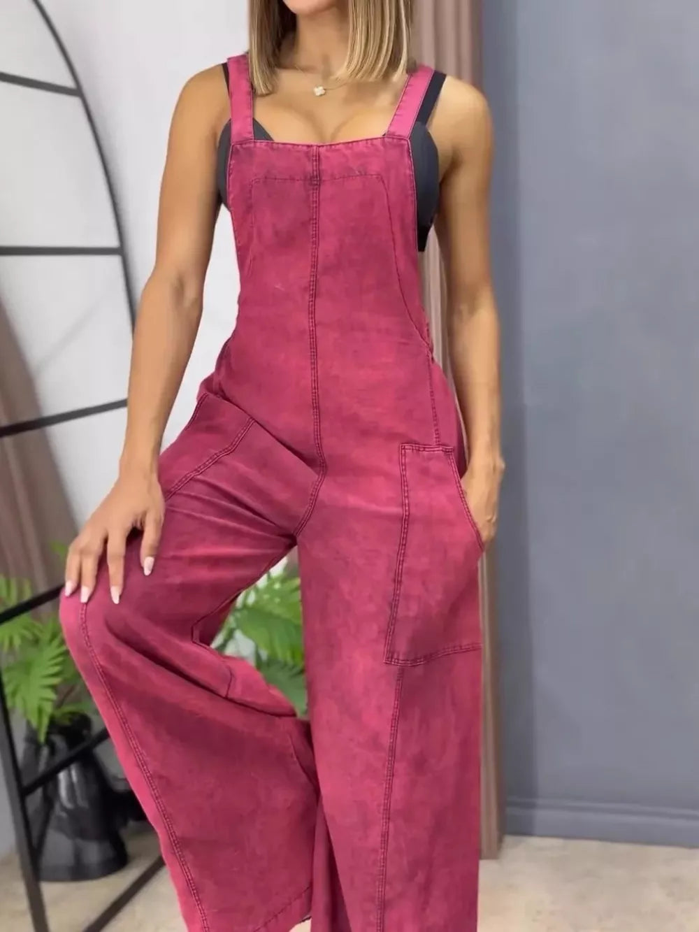 Rose Red vintage wash wide-leg denim overalls with bib front and pockets.