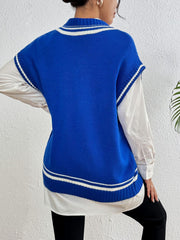 Blue acrylic knit vest with white varsity stripes and pearl trim detail, layered over a white shirt.