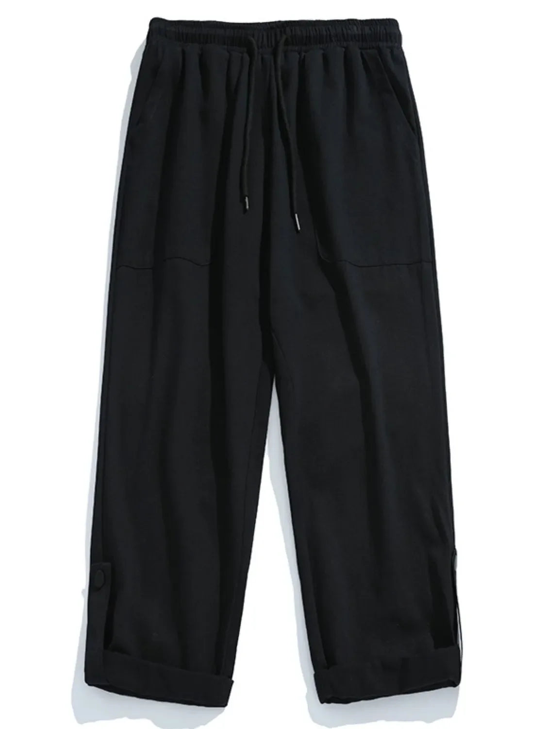 Black relaxed fit cuffed cargo trousers with drawstring waist and button detail.