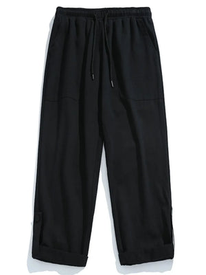 Black relaxed fit cuffed cargo trousers with drawstring waist and button detail.