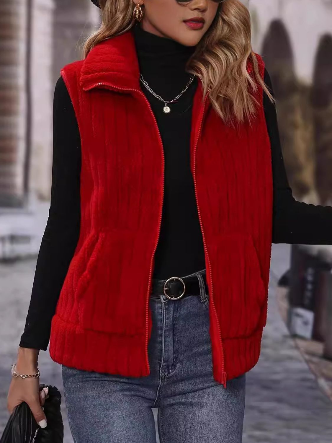 Red plush corduroy zip-up gilet vest with collar and pockets.