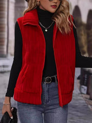 Red plush corduroy zip-up gilet vest with collar and pockets.