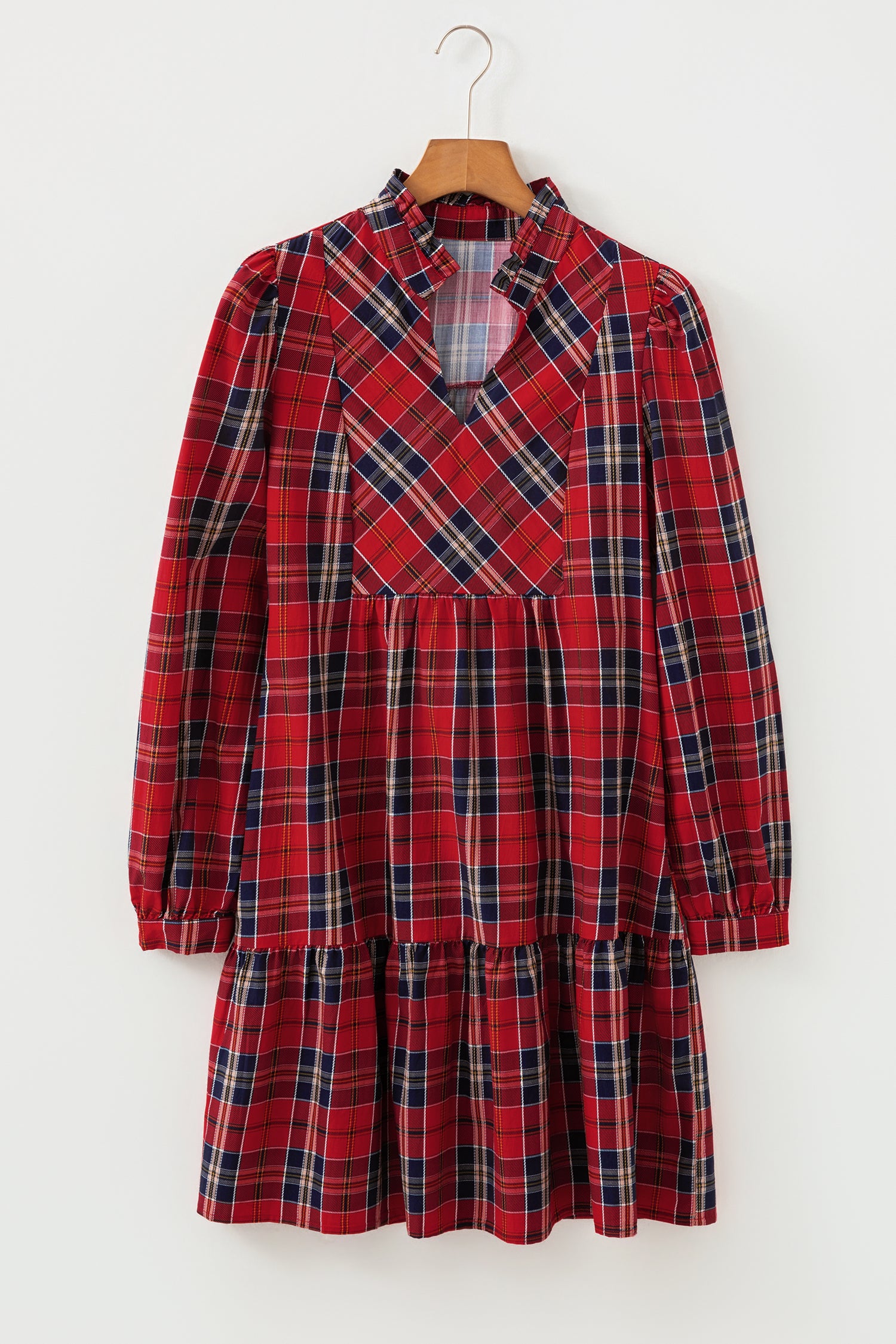 Red tartan mini dress with frilly collar, V-neck, and tiered skirt.