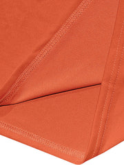 Orange cotton t-shirt detail showing stitching and fabric texture.