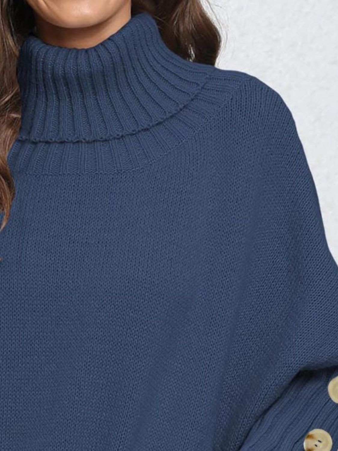 Dark blue turtleneck sweater with button cuffs