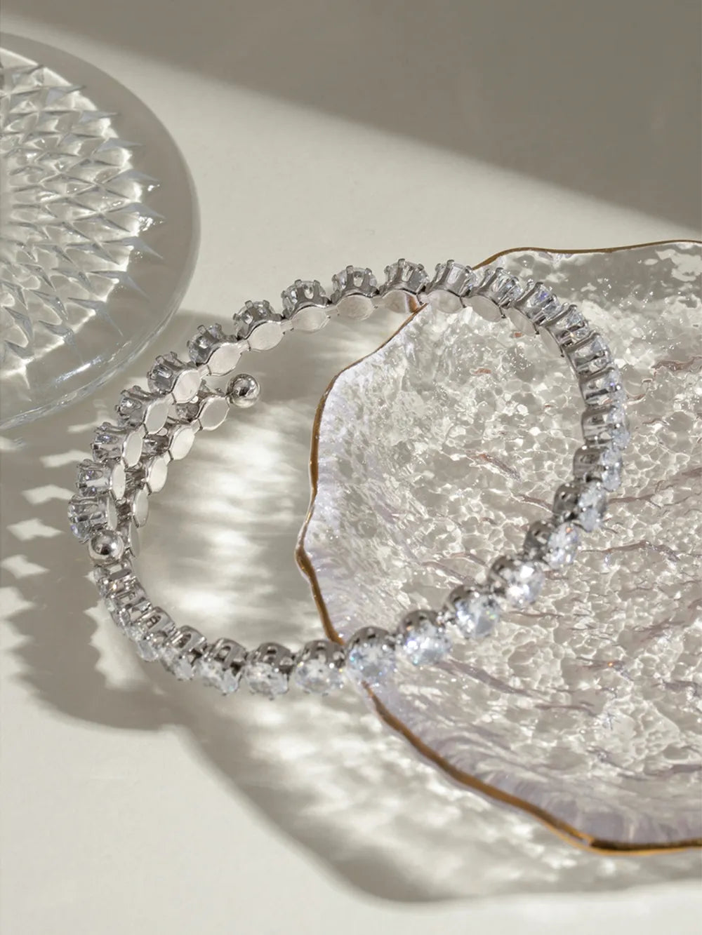Silver double row pavé bangle bracelet with clear stones.