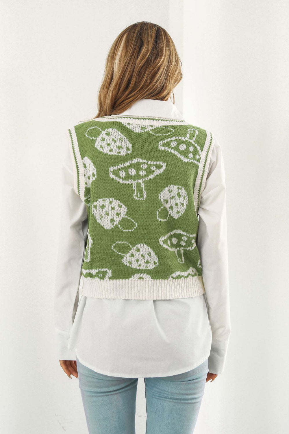 Matcha green acrylic knit vest with white mushroom motif and cream trim