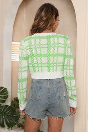 Plaid crop cardigan with puff shoulders in green and white acrylic, buttoned, casual style.