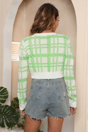 Plaid crop cardigan with puff shoulders in green and white acrylic, buttoned, casual style.