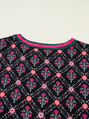 Black cotton blouse with vintage floral pattern and contrast neckline trim.