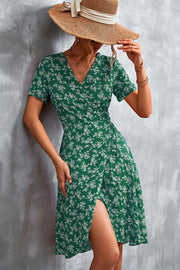 Crimson Floral Wrap Midi Dress in Light Green with a V-neck and short sleeves.