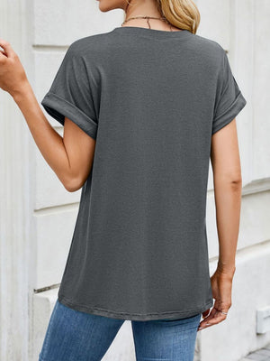 Gray crew neck t-shirt with cuffed sleeves and a relaxed fit.