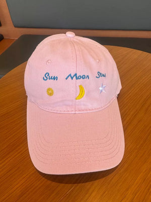 Blush pink cotton baseball cap with celestial embroidery and text.