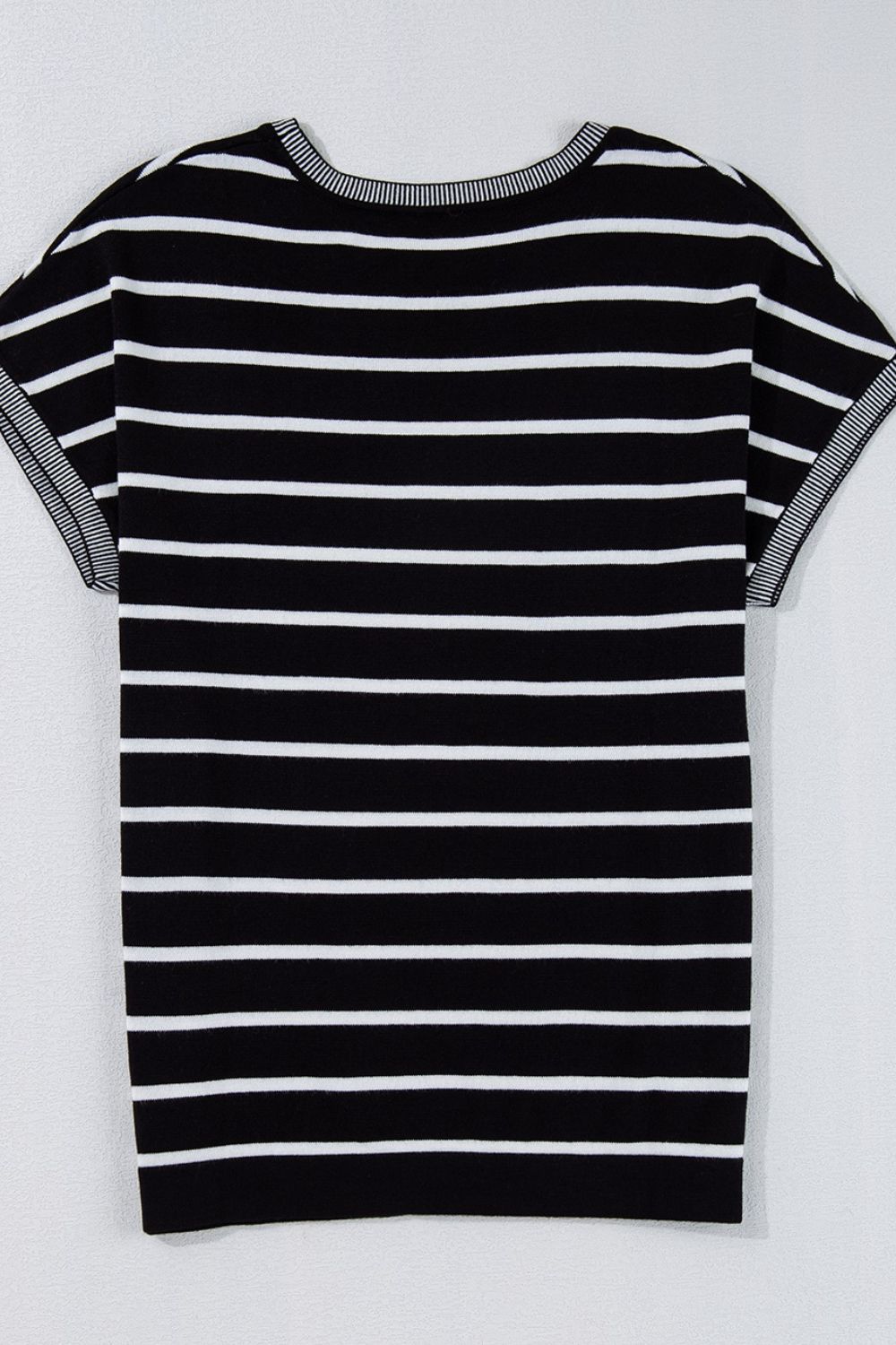 Black and white striped boxy tee with contrast trim on neckline and sleeves.