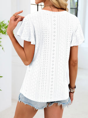 White eyelet t-shirt with flutter sleeves and a patterned texture.
