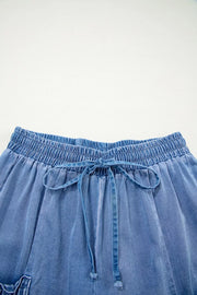 Relaxed denim maternity jeans with elastic drawstring waist and tie detail.