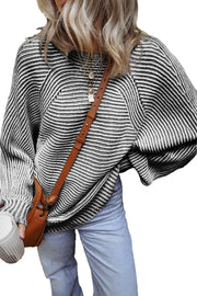 Textured stripe batwing knit sweater in black and white with a relaxed fit.