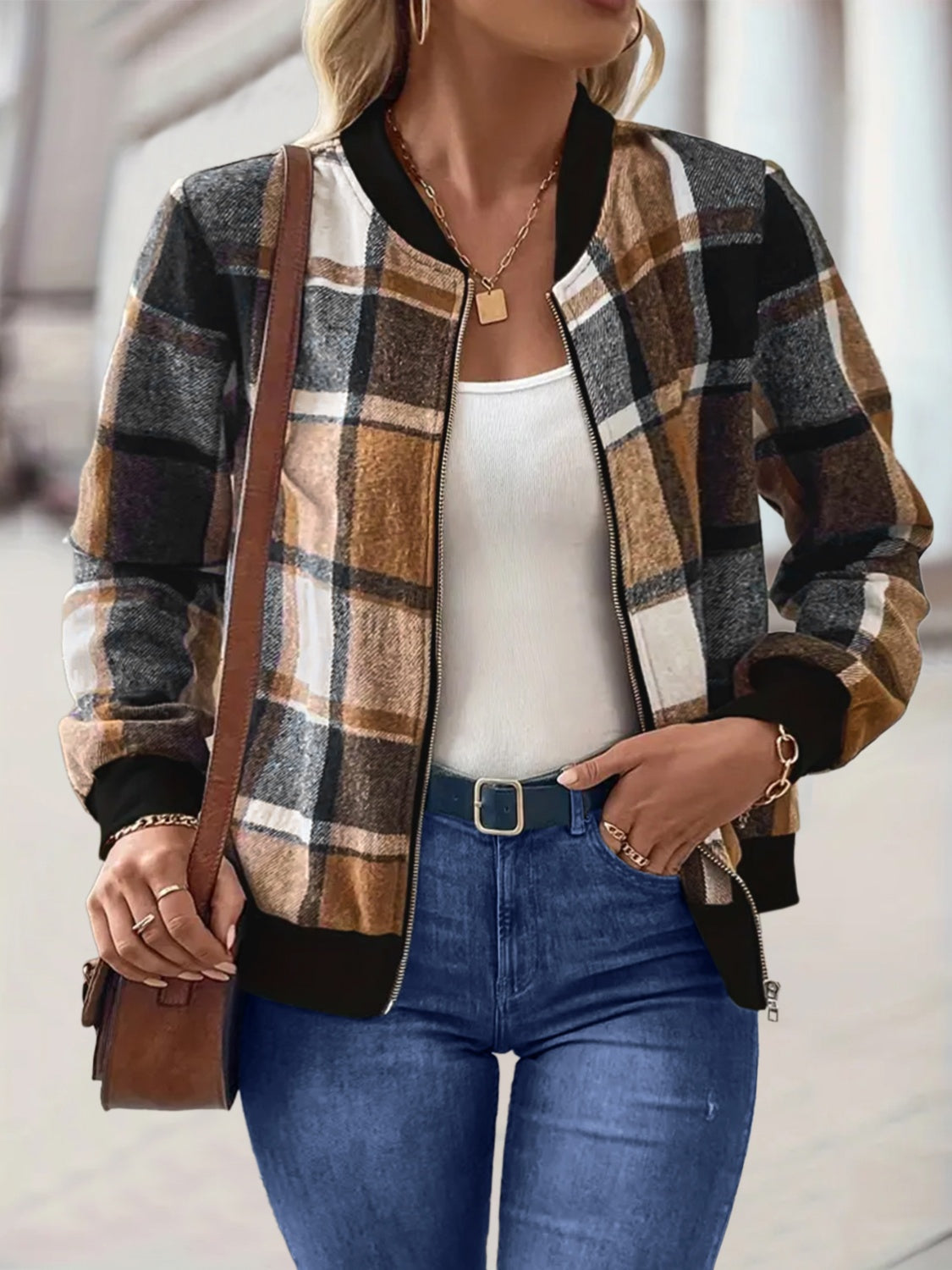 Plaid bomber jacket in caramel and black with ribbed cuffs and collar.