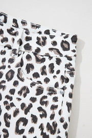Leopard print denim shorts with frayed hem detail
