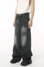 Oversized wash denim jeans in charcoal grey with a baggy fit.