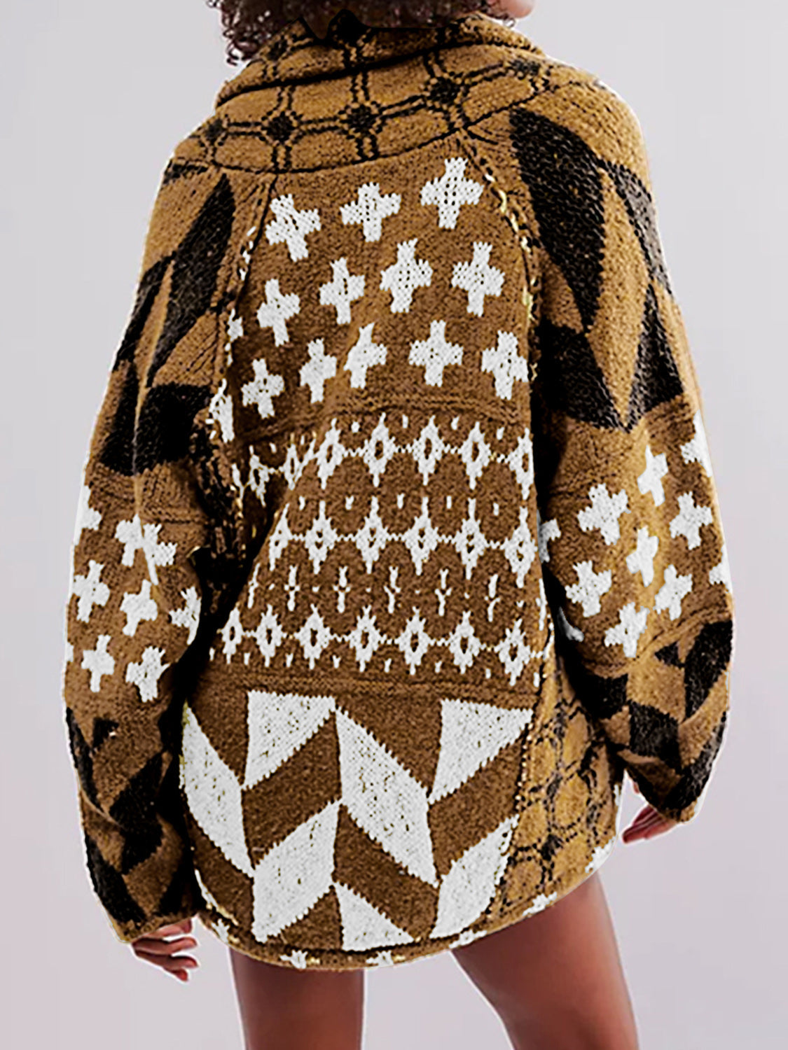 Geometric patchwork knit cardigan in brown with white and black patterns, featuring a relaxed fit and long sleeves.
