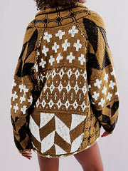 Geometric patchwork knit cardigan in brown with white and black patterns, featuring a relaxed fit and long sleeves.