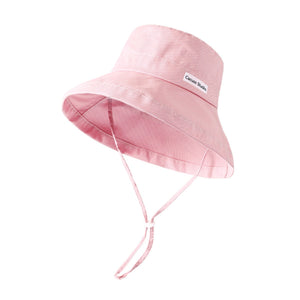Pink corduroy bucket hat with wide brim and chin strap