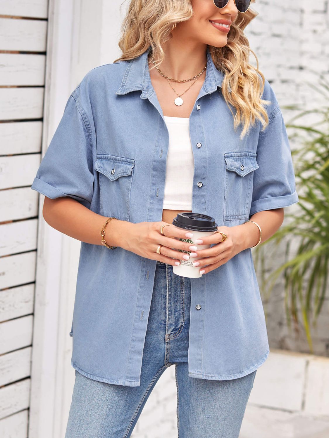Relaxed light denim shirt jacket with cuffed sleeves and buttoned chest pockets.