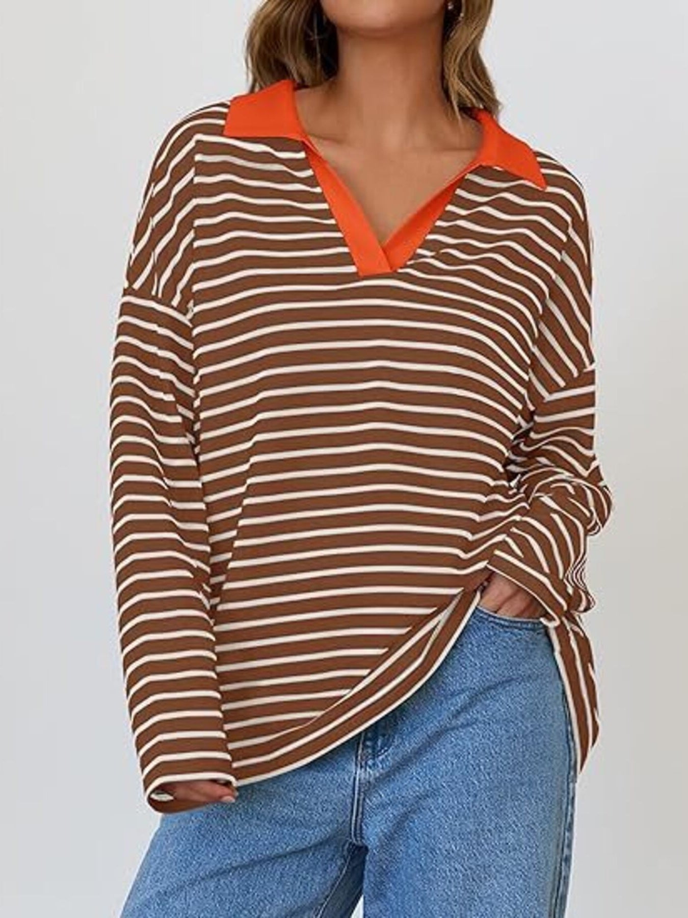 Oversized brown and white striped long-sleeve sweatshirt with orange collar detail