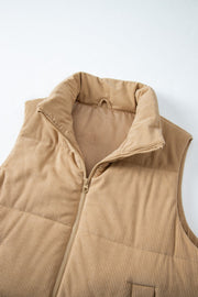 Tan corduroy padded funnel neck vest with a zipper closure.