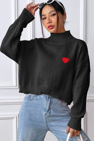 Black cropped turtleneck sweater with embroidered red heart detail
