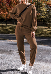 Relaxed fit coffee brown loungewear set with crewneck sweatshirt and drawstring pants.