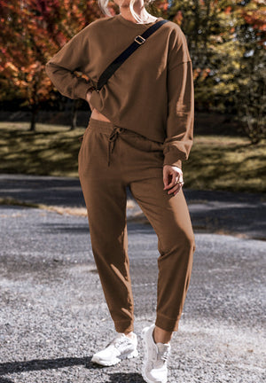 Relaxed fit coffee brown loungewear set with crewneck sweatshirt and drawstring pants.