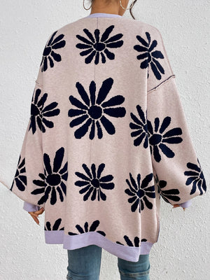 Floral jacquard knit cardigan in pale blush with navy floral print and lavender trim.