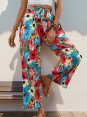 Painterly floral wide-leg trousers with a tie waist in multicolor.