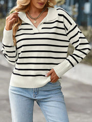 Striped knit polo sweater with a v-neck and long sleeves in cream and black.