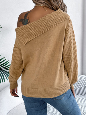 Camel off-shoulder cable knit pullover sweater with textured sleeves.