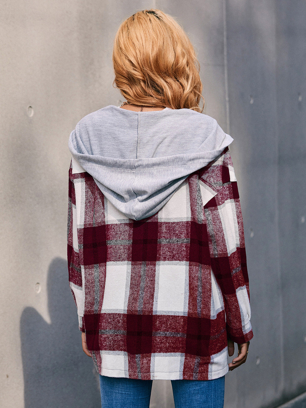 Oversized burgundy plaid shacket with grey hood, casual long sleeve outerwear.