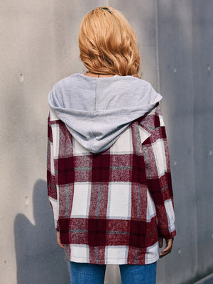Oversized burgundy plaid shacket with grey hood, casual long sleeve outerwear.