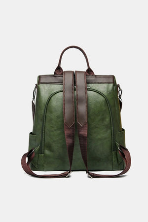 Dark green structured leather convertible backpack with brown straps and trim