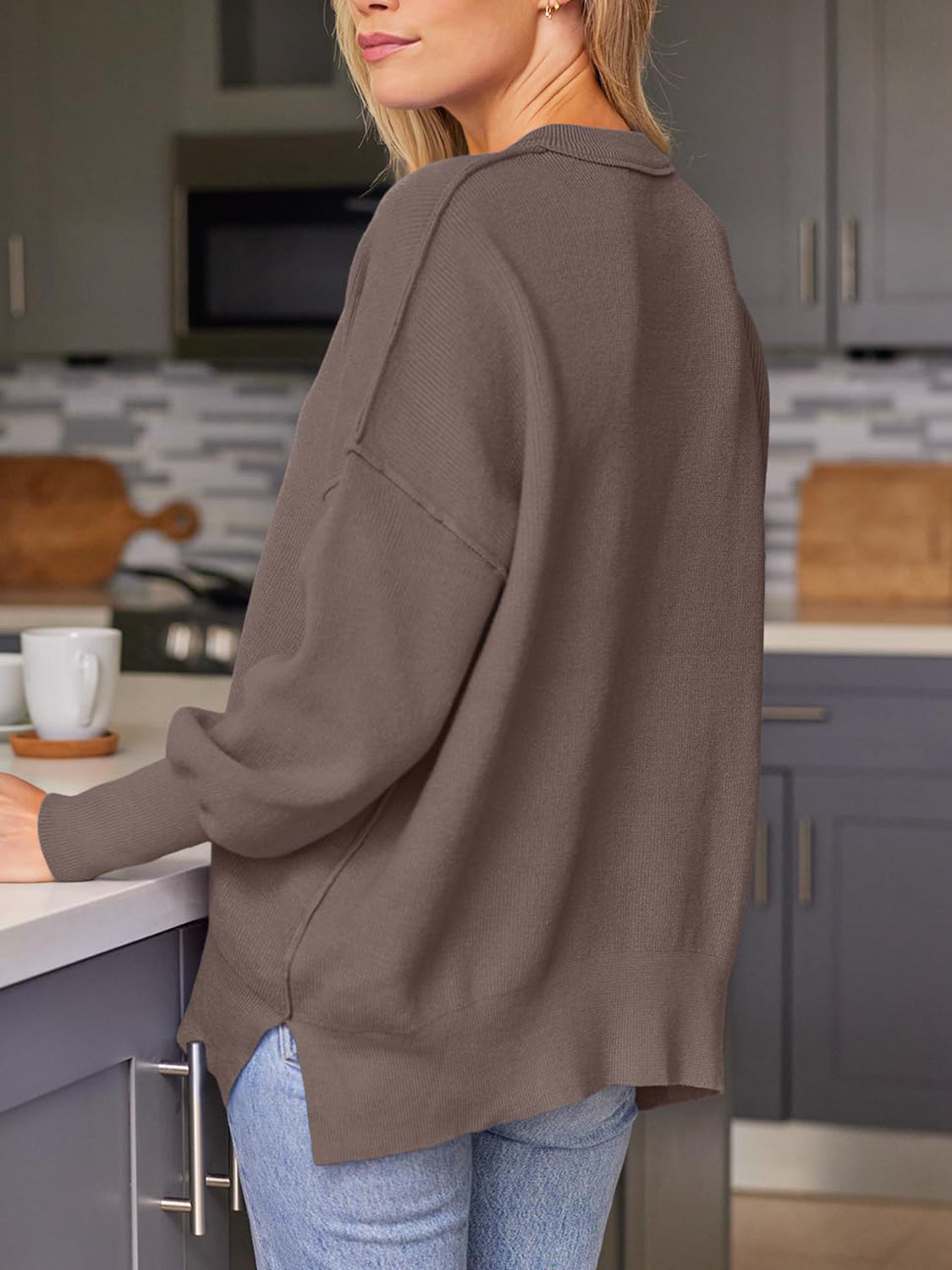 Ribbed-knit relaxed fit sweater in brown with crew neck and drop shoulders.