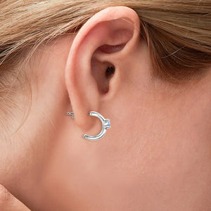 Silver triple-bar crystal stud earrings with a single blue stone accent.
