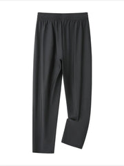 Grey men's sweatpants with elastic waistband and drawstring, relaxed fit.