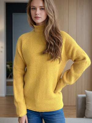 Yellow ribbed turtleneck sweater with raglan sleeves and relaxed fit.