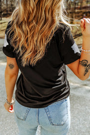 Black crew neck t-shirt with glitter ghost motif on shoulders